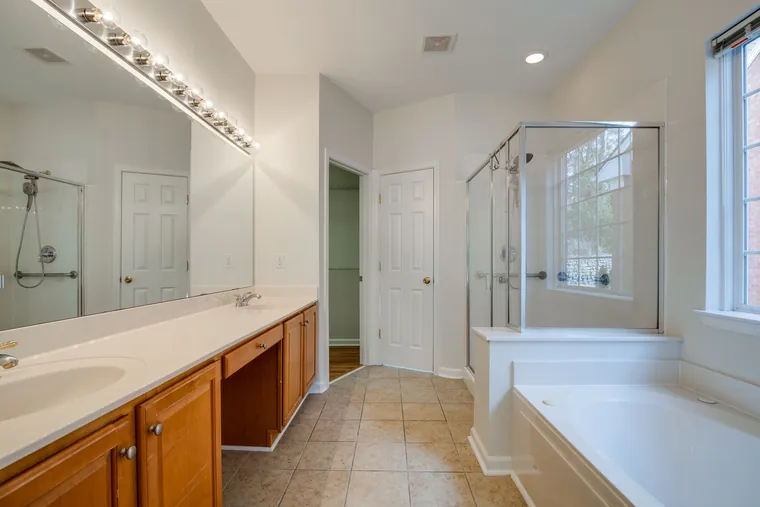 Primary en suite with double vanity, separate tub and shower